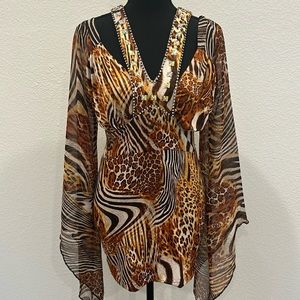 Leopard print dress. Can be use as a blouse with leggings